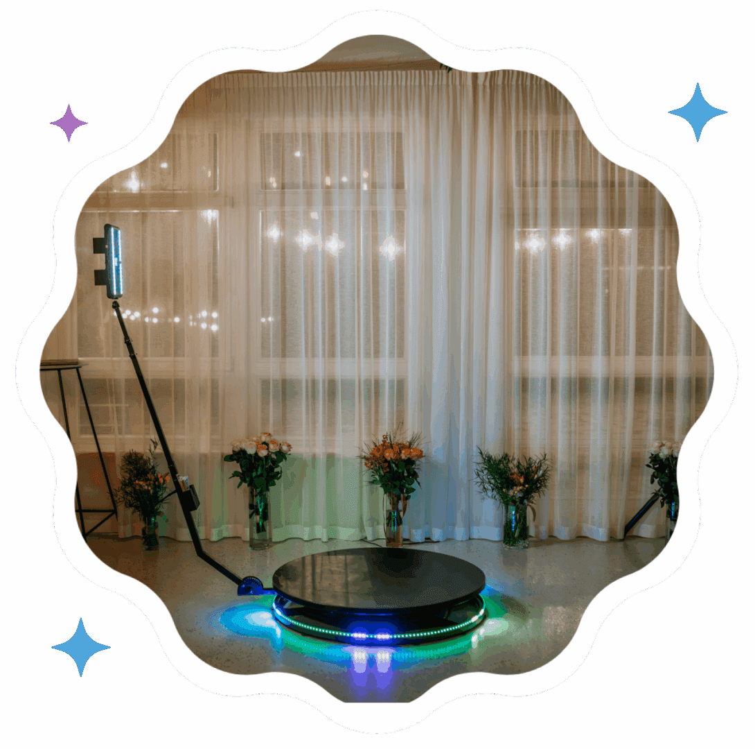 A sleek robot vacuum cleaner in a modern living room with sheer curtains.