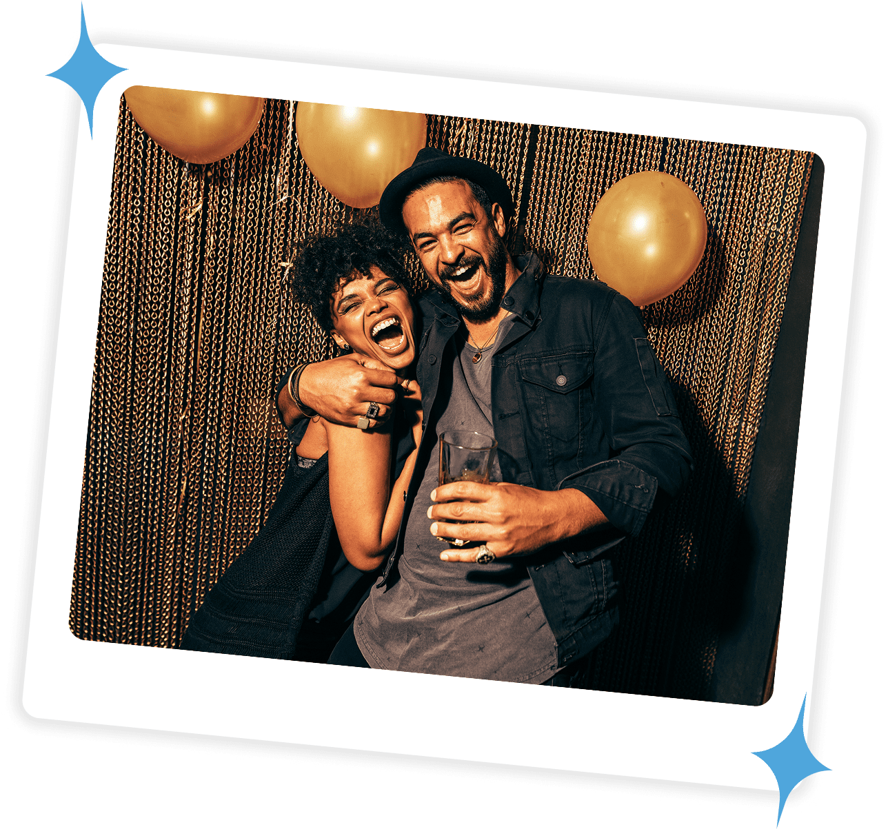 A joyful couple posing together with balloons in the background.